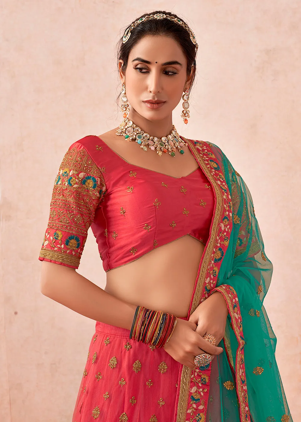 Traditional Peach Coral Kalidar Embroidered Net Lehenga Choli