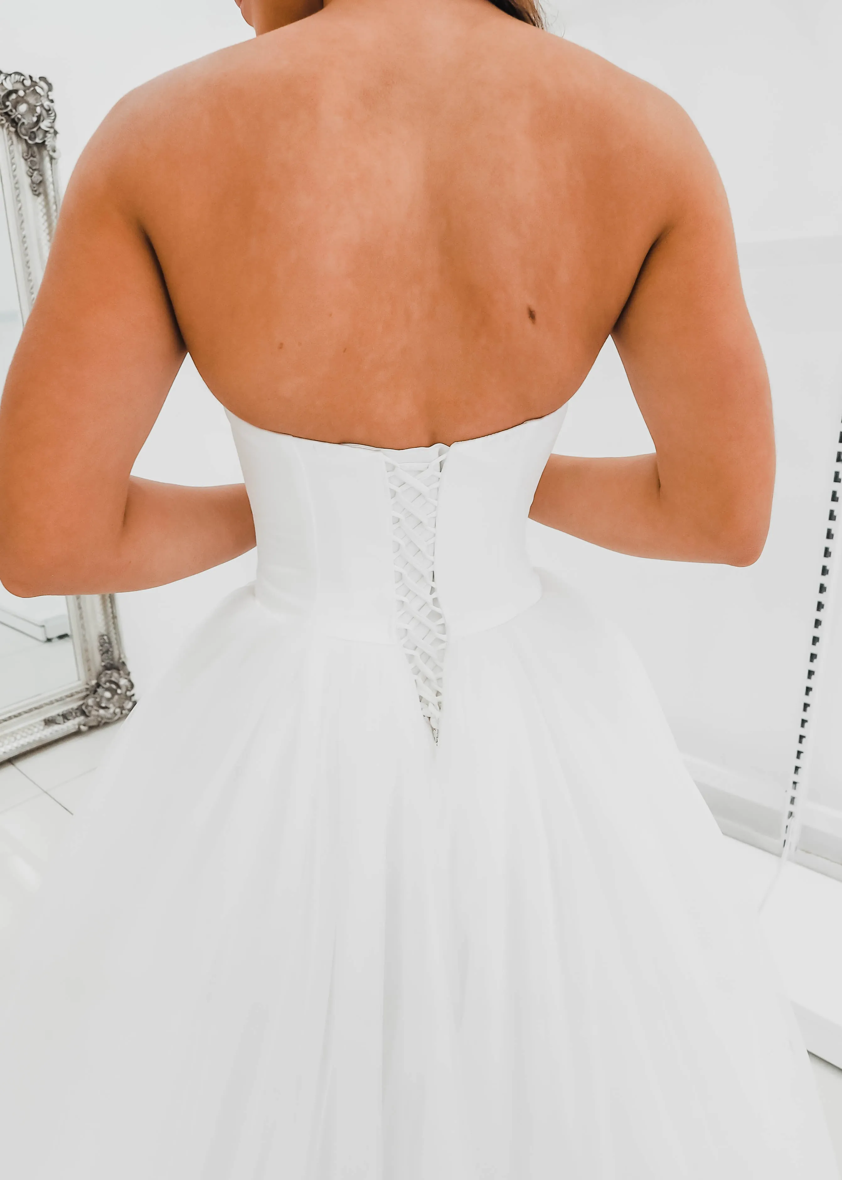 White sweetheart neckline and satin bodice with puffy tulle skirt wedding dress